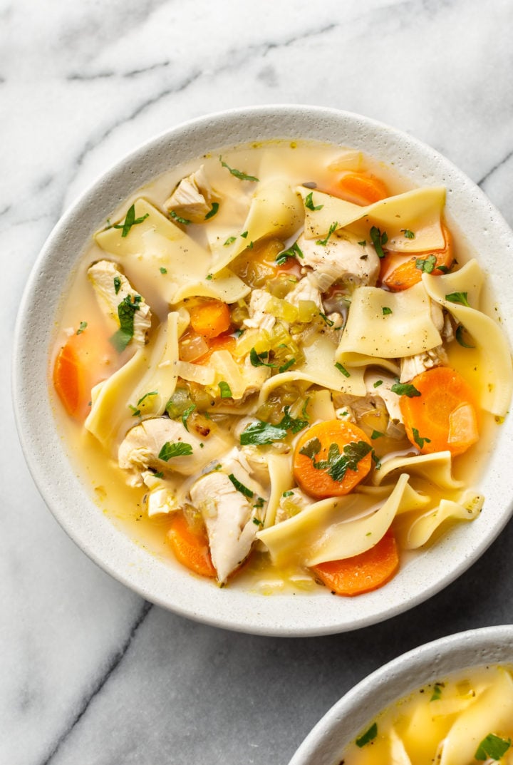 the best chicken noodle soup (in two bowls with one close-up)