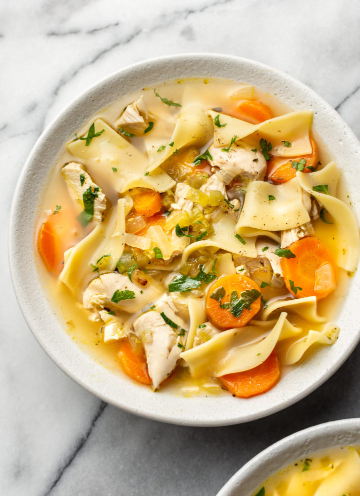 the best chicken noodle soup (in two bowls with one close-up)