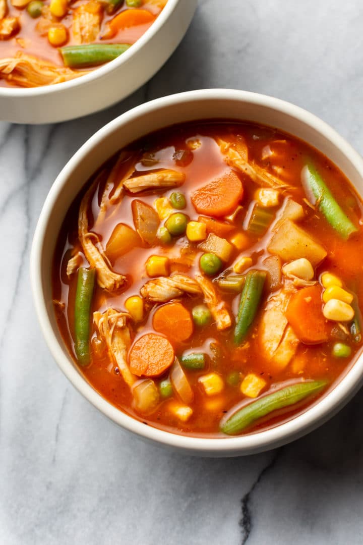 two bowls of chicken vegetable soup