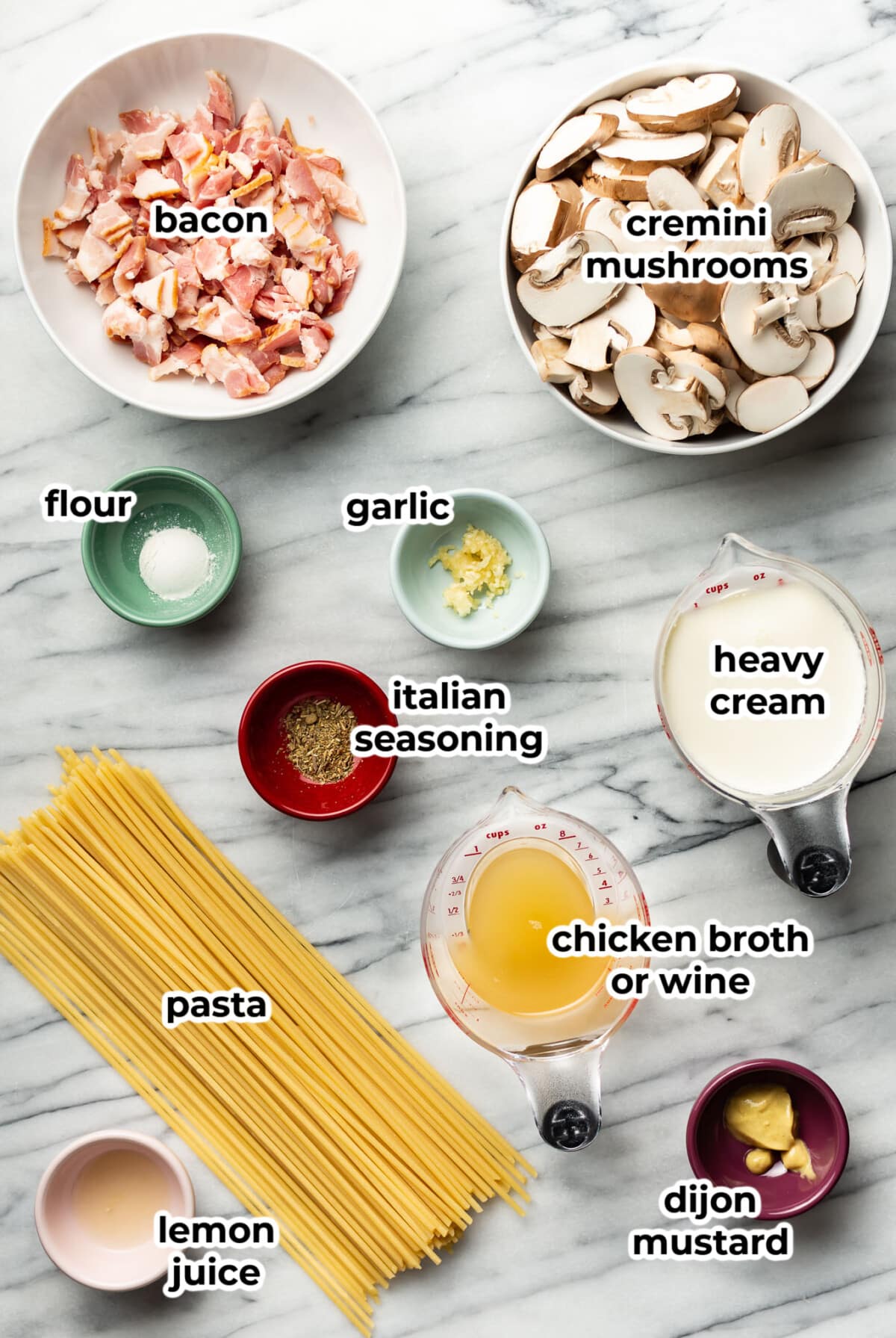 ingredients for creamy bacon mushroom pasta in prep bowls