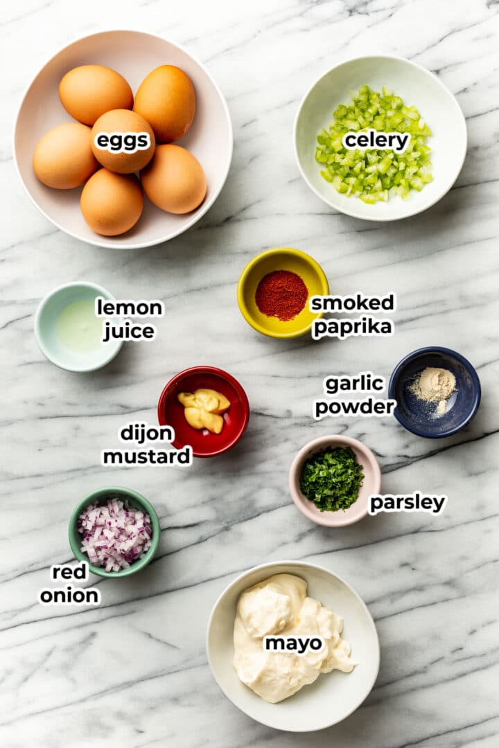 ingredients for egg salad in prep bowls
