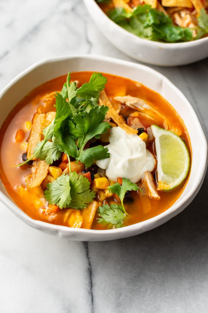 Mexican chicken soup in two bowls