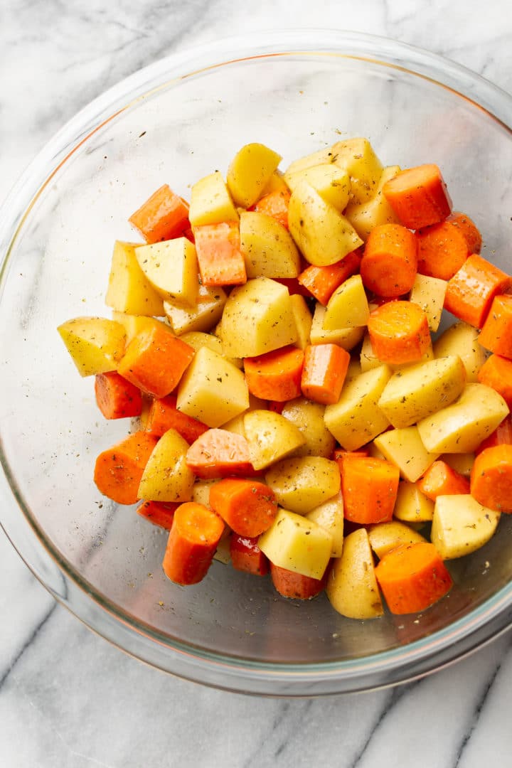 cut-up potatoes and carrots in a glass prep bowl