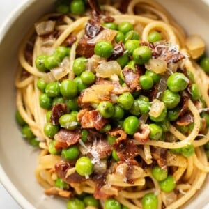 bacon and pea pasta in a bowl