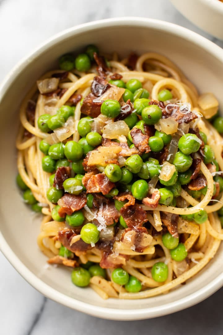 bacon and pea pasta in a bowl