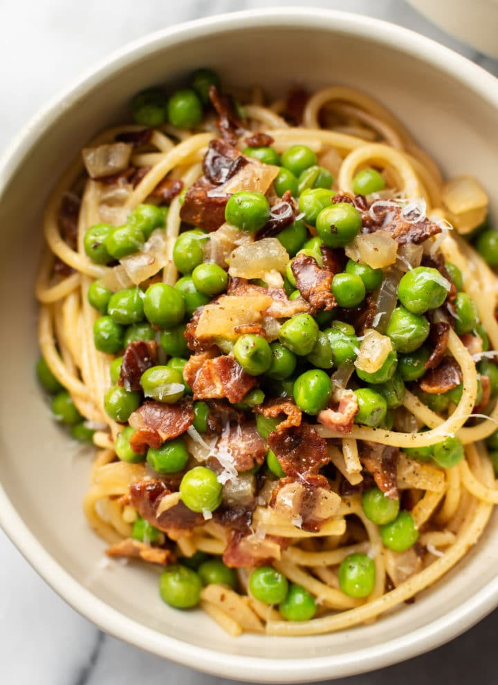 bacon and pea pasta in a bowl