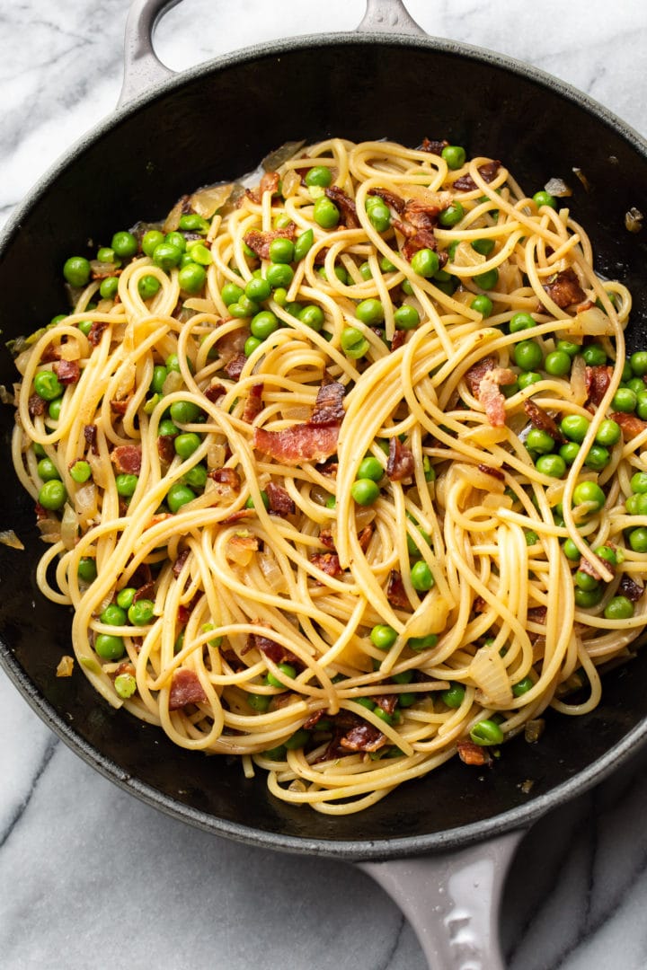 bacon and pea pasta in a skillet