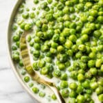 close-up of creamed peas in a serving bowl