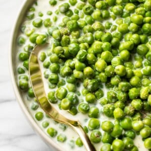 close-up of creamed peas in a serving bowl