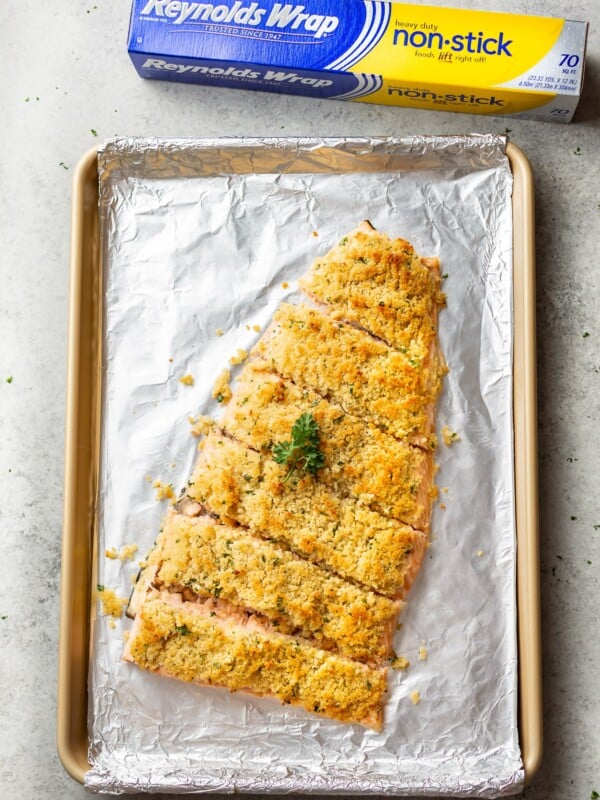 maple dijon baked salmon on a baking sheet with Reynolds Wrap foil in the background