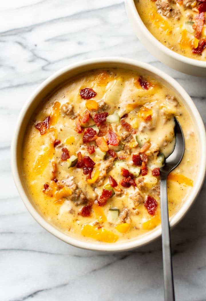 creamy cheeseburger soup in two bowls