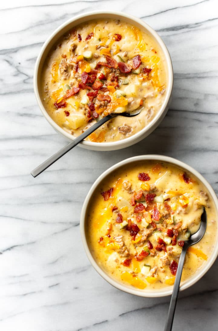 cheeseburger soup in two beige bowls