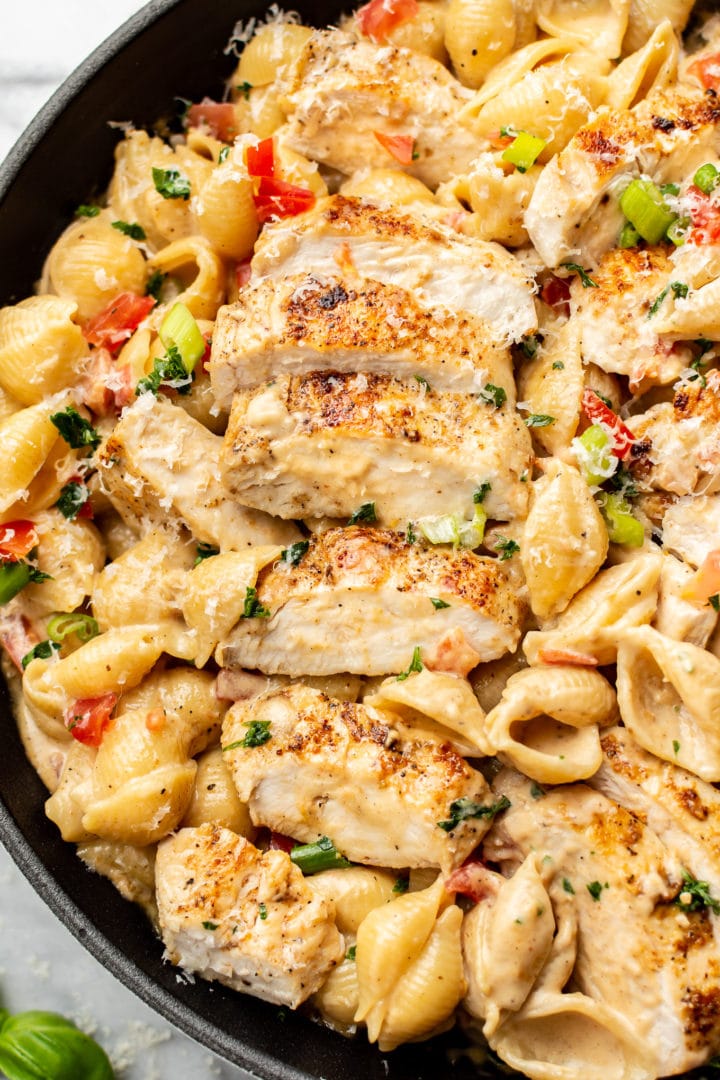 close-up of creamy Cajun chicken pasta in a skillet