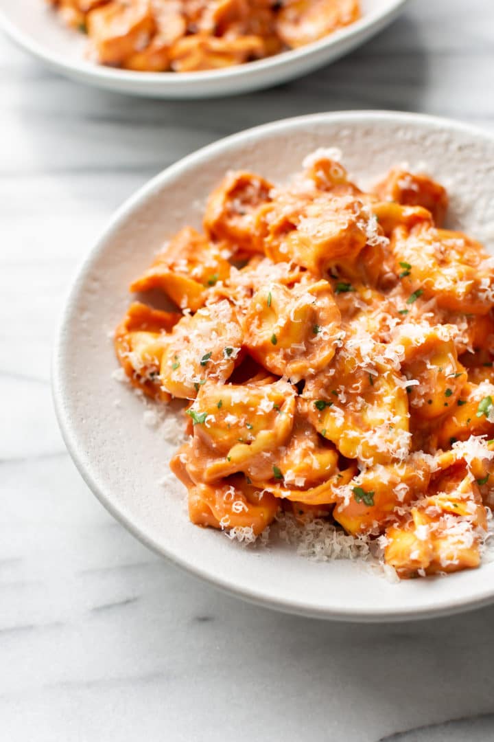 tomato tortellini in two shallow bowls