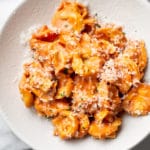 creamy tomato tortellini close-up in shallow bowl