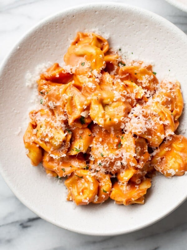 creamy tomato tortellini close-up in shallow bowl