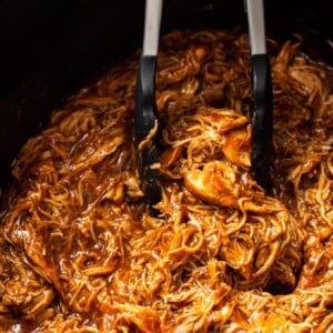 Crockpot shredded BBQ chicken close-up in slow cooker