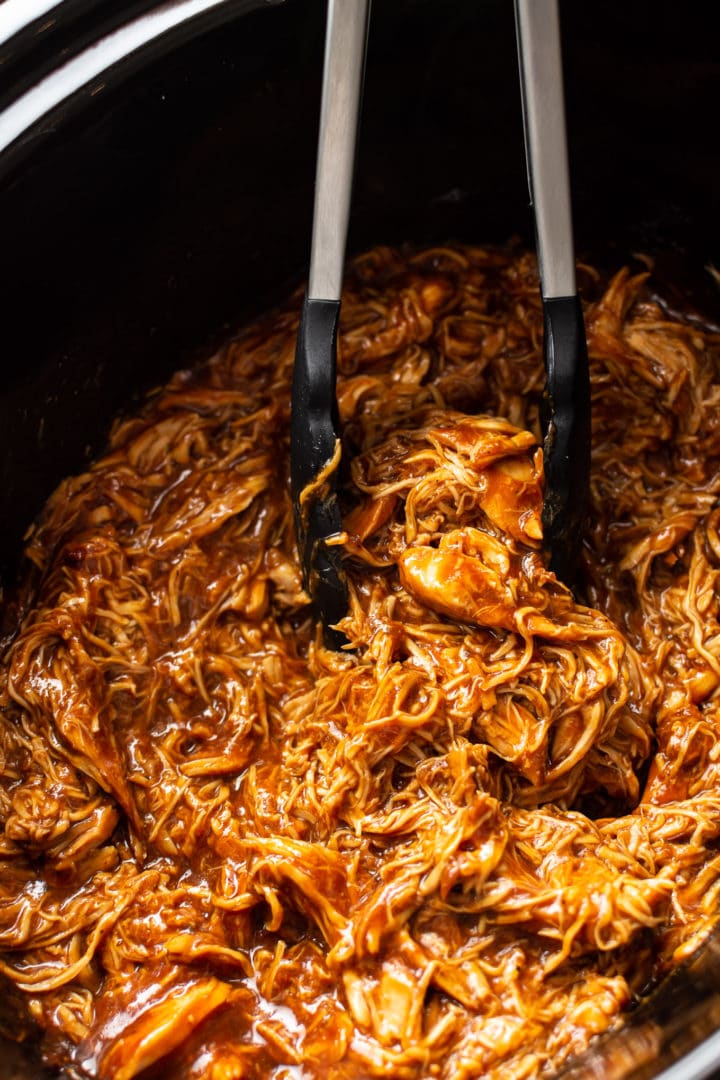 Crockpot shredded BBQ chicken close-up in slow cooker