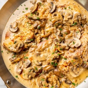 close-up of sherry chicken in a copper skillet