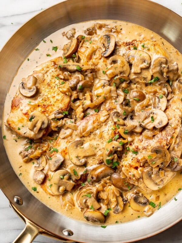 close-up of sherry chicken in a copper skillet