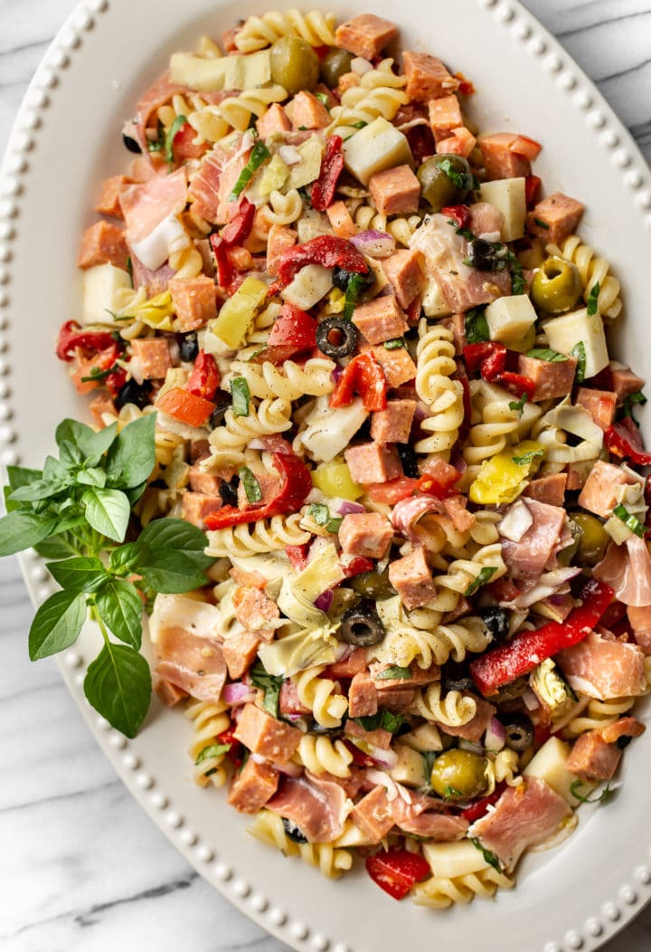 easy antipasto salad on a white platter