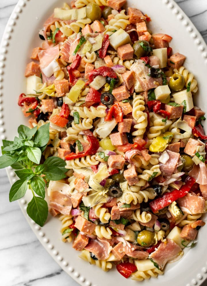 easy antipasto salad on a white platter