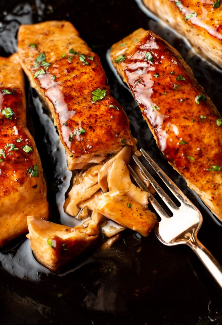 close-up of brown sugar glazed salmon flaked with a fork