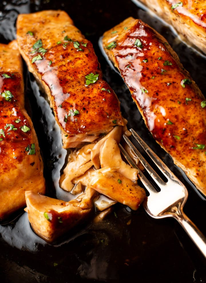 close-up of brown sugar glazed salmon flaked with a fork