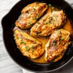 Cajun garlic butter chicken breasts in a skillet