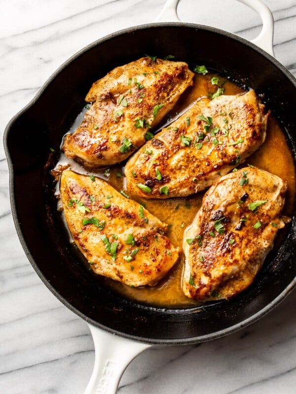 Cajun garlic butter chicken breasts in a skillet