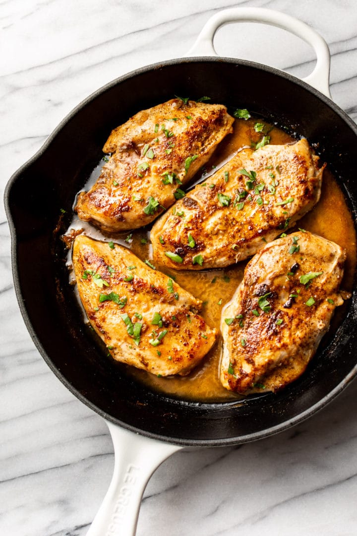 Cajun garlic butter chicken breasts in a skillet