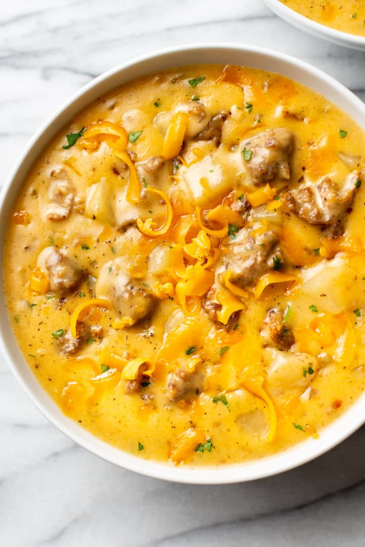 close-up of a bowl of cheesy Italian sausage potato soup