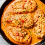 chicken in a tomato cream sauce in a skillet