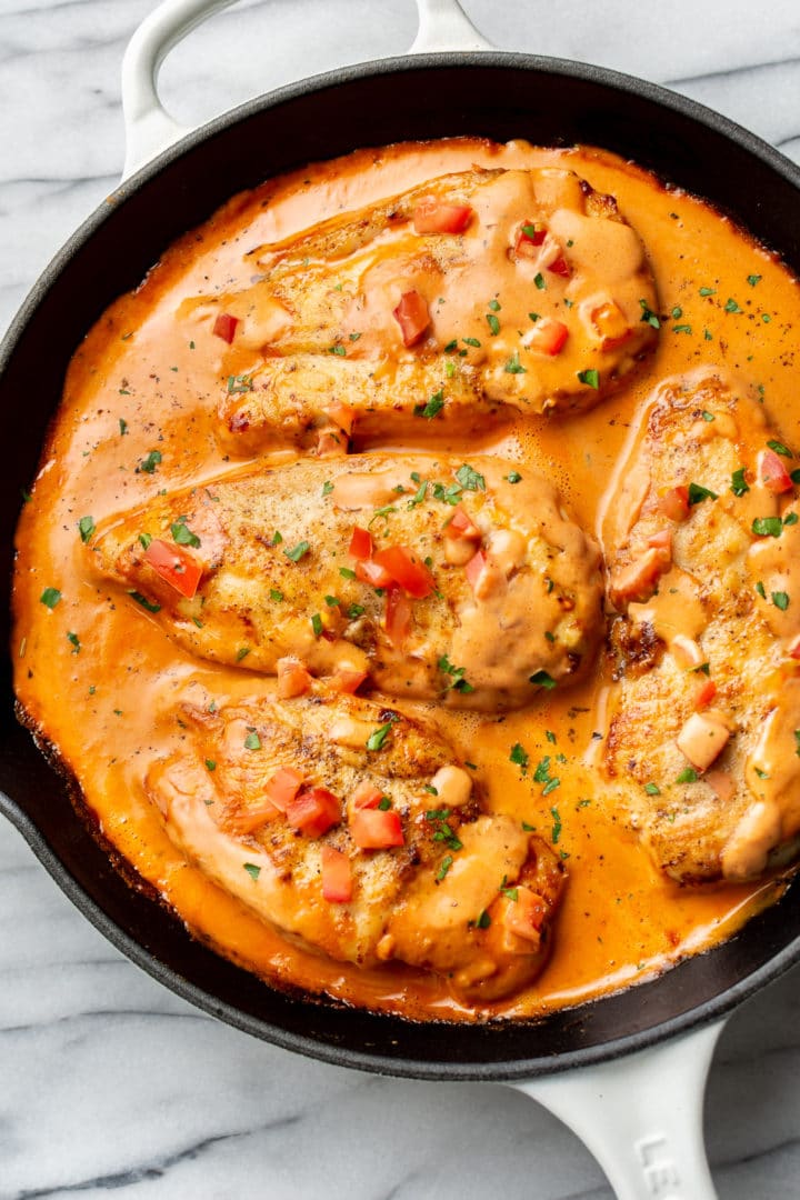 chicken in a tomato cream sauce in a skillet