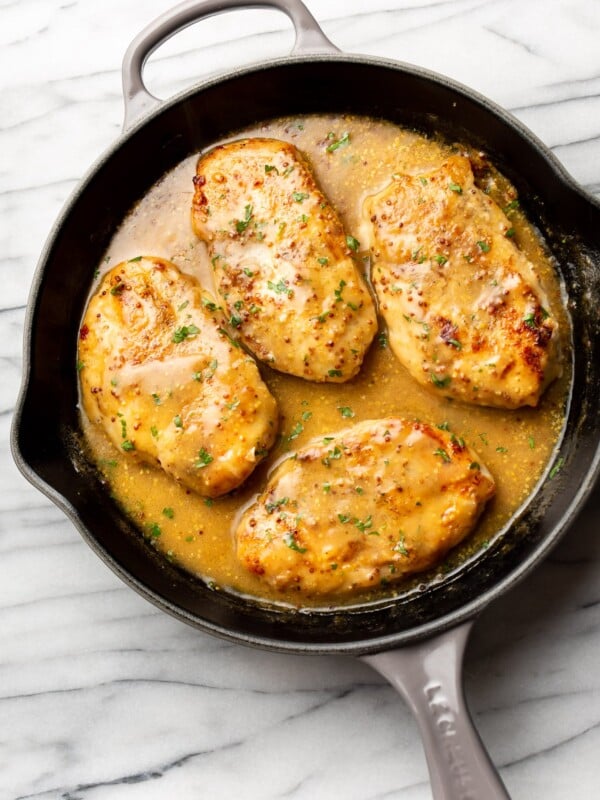 easy honey mustard chicken in a cast iron skillet