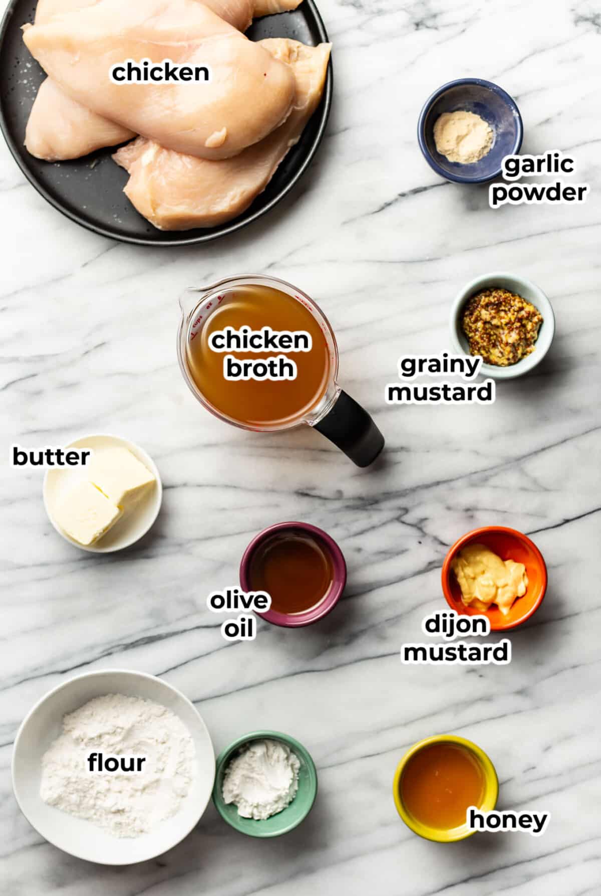 ingredients for honey mustard chicken in prep bowls