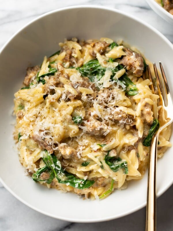 one pot orzo with Italian sausage in a white bowl