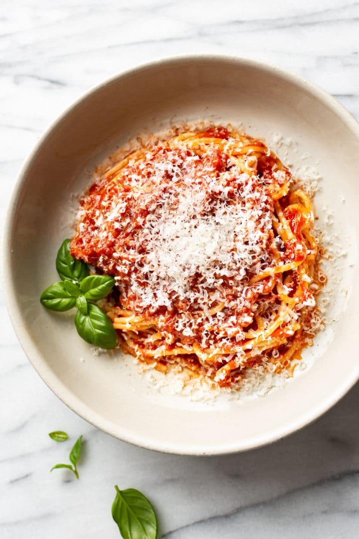 easy homemade marinara sauce over spaghetti in a shallow bowl
