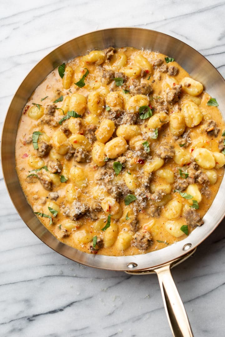 close-up of spicy Italian sausage gnocchi in a skillet