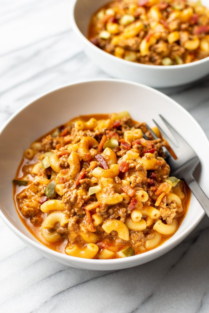 two white bowls with cheeseburger pasta