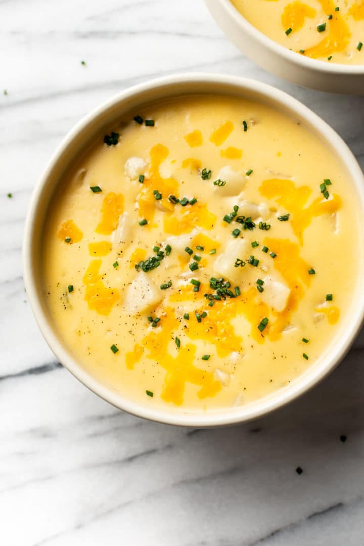 cheesy potato soup in two bowls