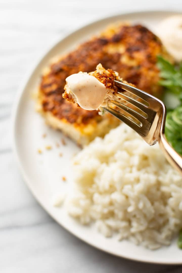 close-up of a bite of a chicken patty on a fork