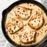 creamy bacon pork chops in a skillet