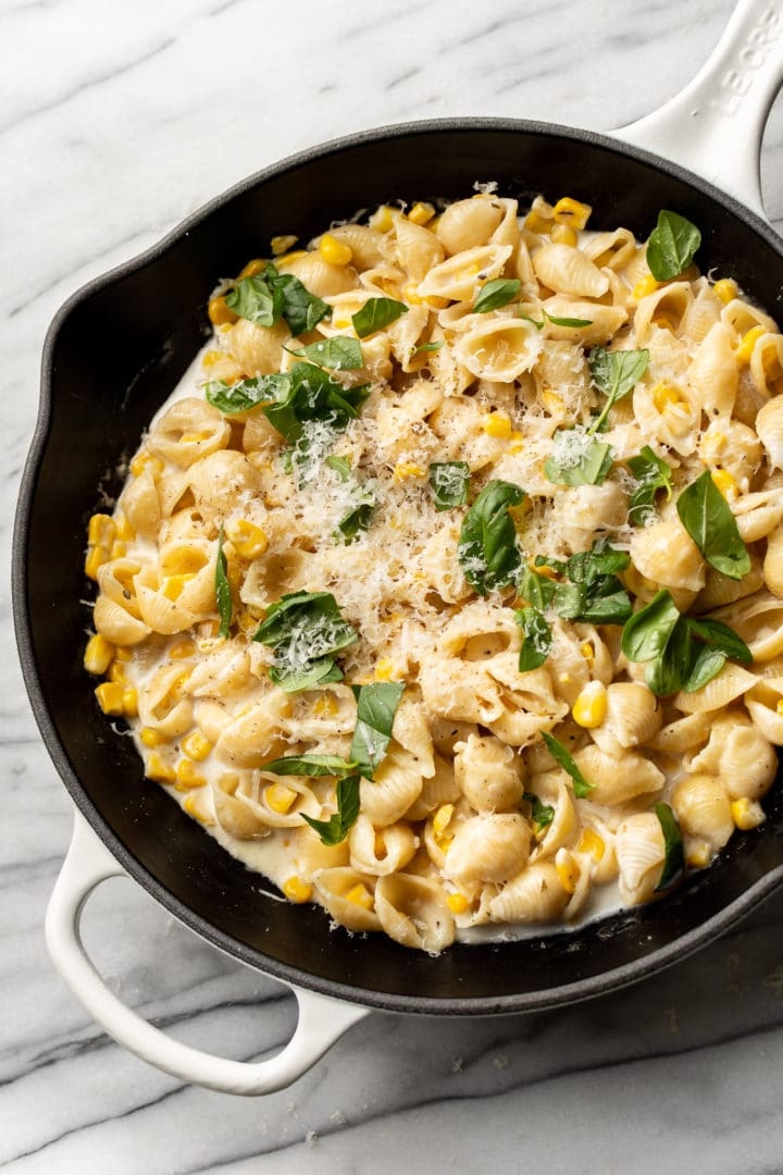 creamy corn pasta in a skillet