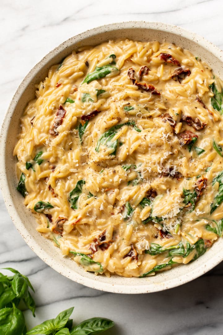 creamy Tuscan orzo in a serving bowl