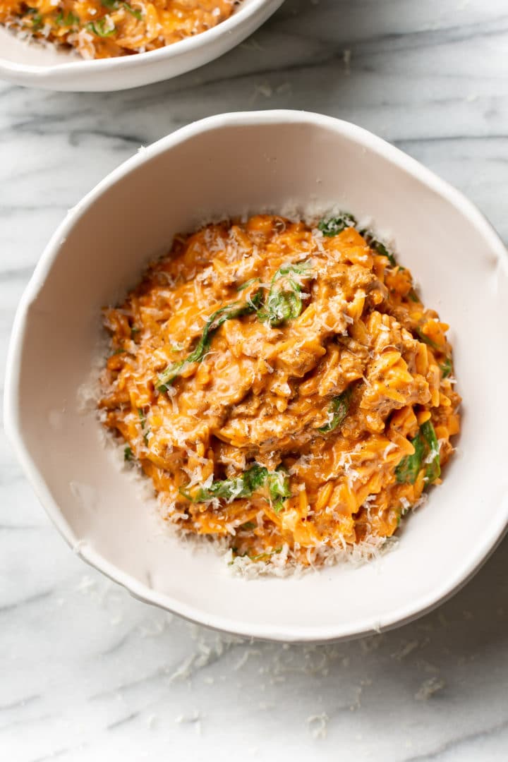 one pot ground beef and orzo in two white bowls