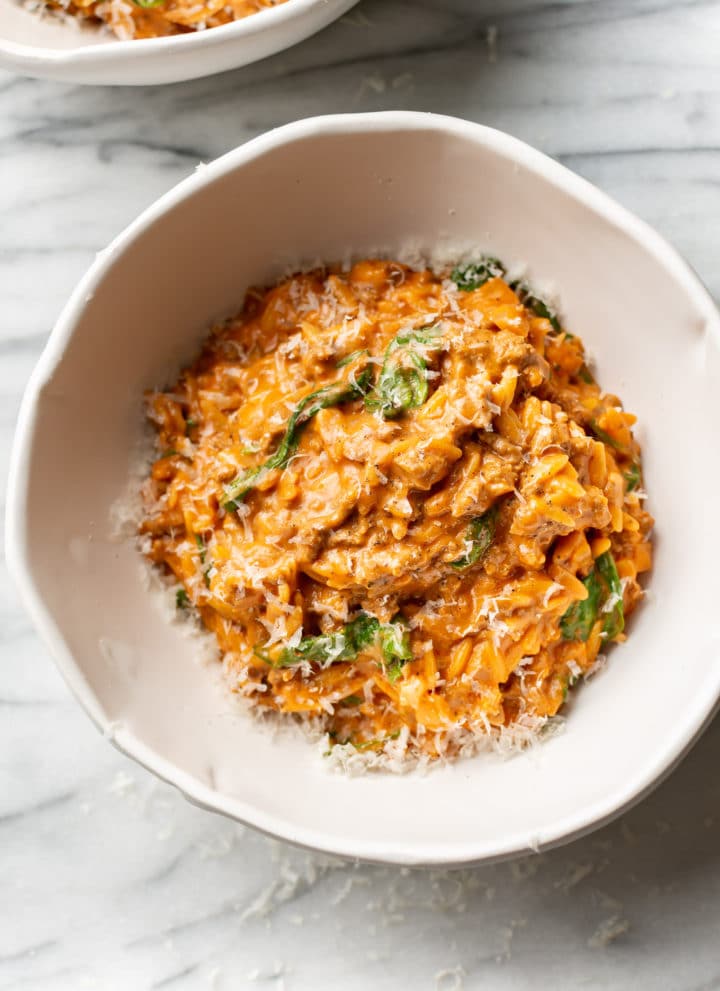 one pot ground beef and orzo in two white bowls