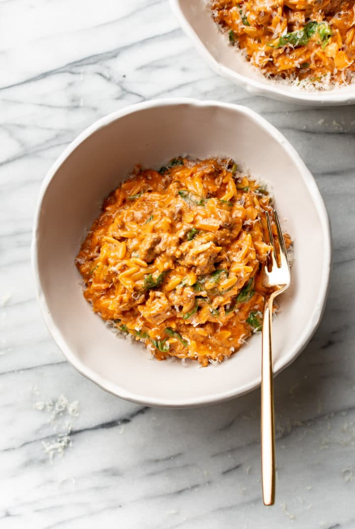 ground beef orzo in two white bowls