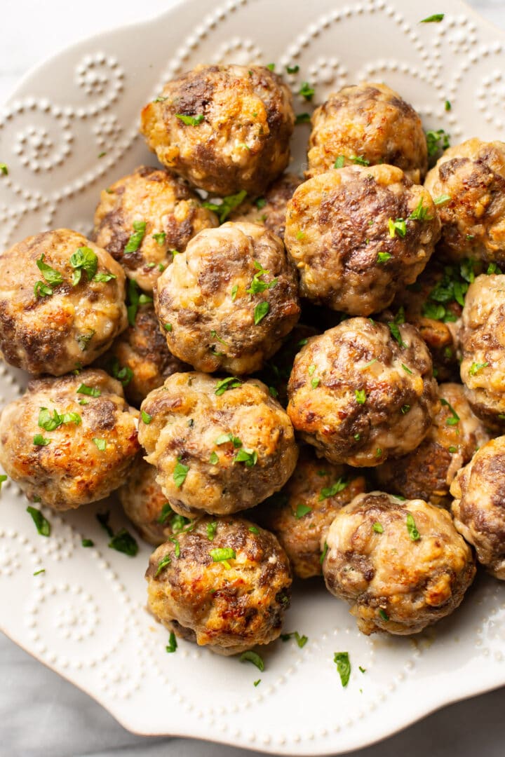 a bowl with several meatballs