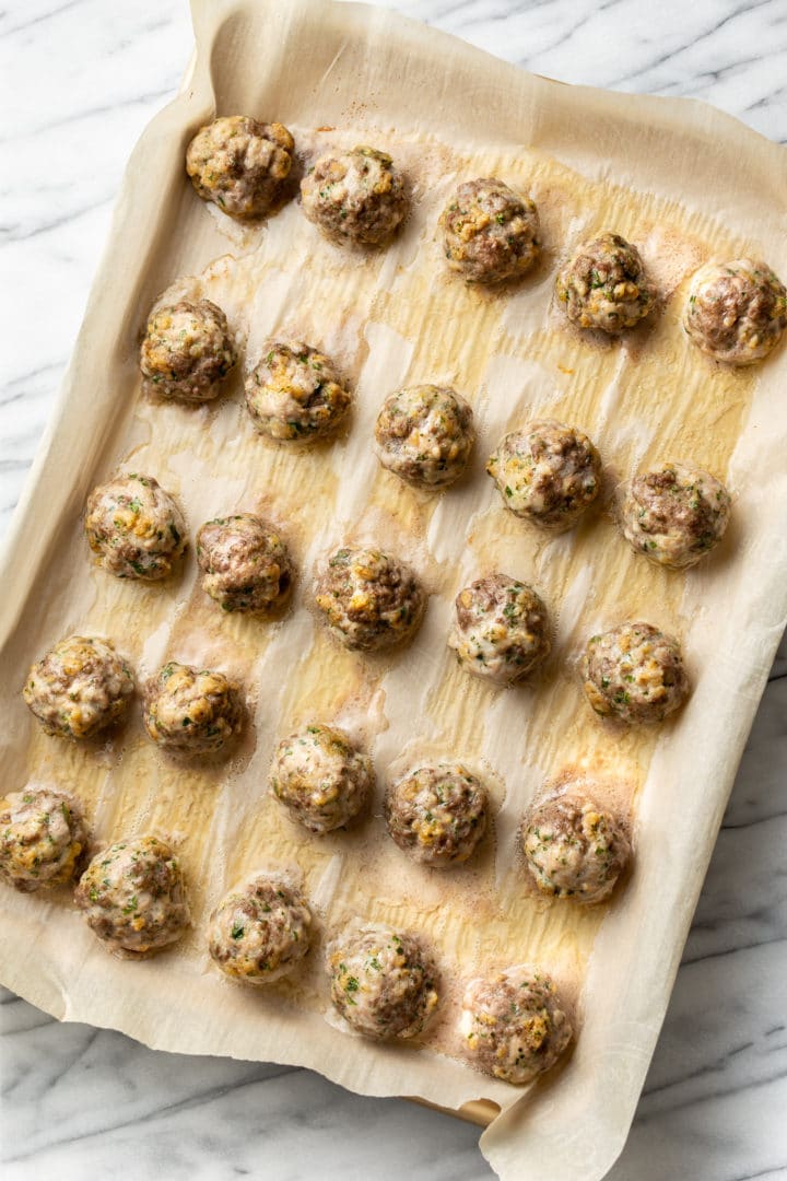 cooked meatballs on a baking sheet